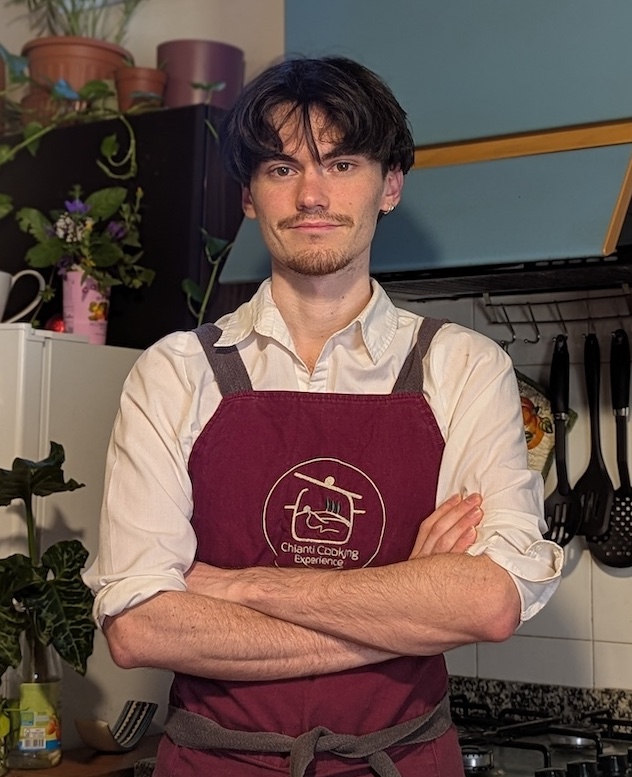 Leopoldo, pizza chef and Paola's son at Chianti Cooking Experience, standing in a home kitchen