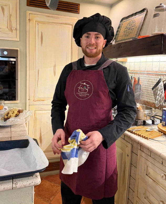 Pizza chef at Chianti Cooking Experience in a traditional Tuscan kitchen