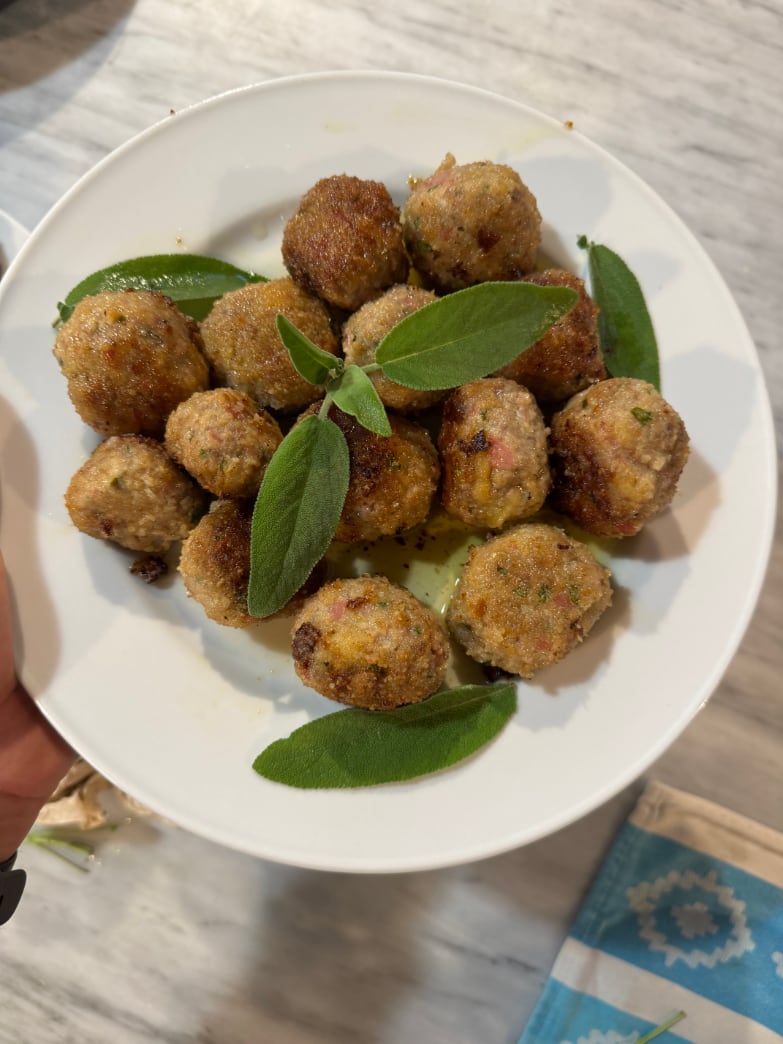 Crispy fried meatballs garnished with fresh sage, dish from the Italian Meal cooking class