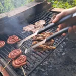 Spiral sausages and grilled chicken on a Tuscan barbecue.
