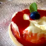 Spoon dessert with strawberry, blueberry and mint leaf sauce