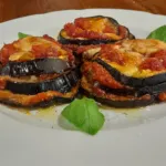 Aubergines parmigiana au gratin served at an event in Tuscany.